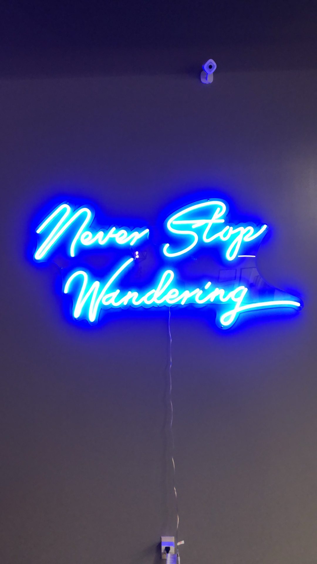Never stop wandering sign in Cloudbeds San Diego headquarters. 